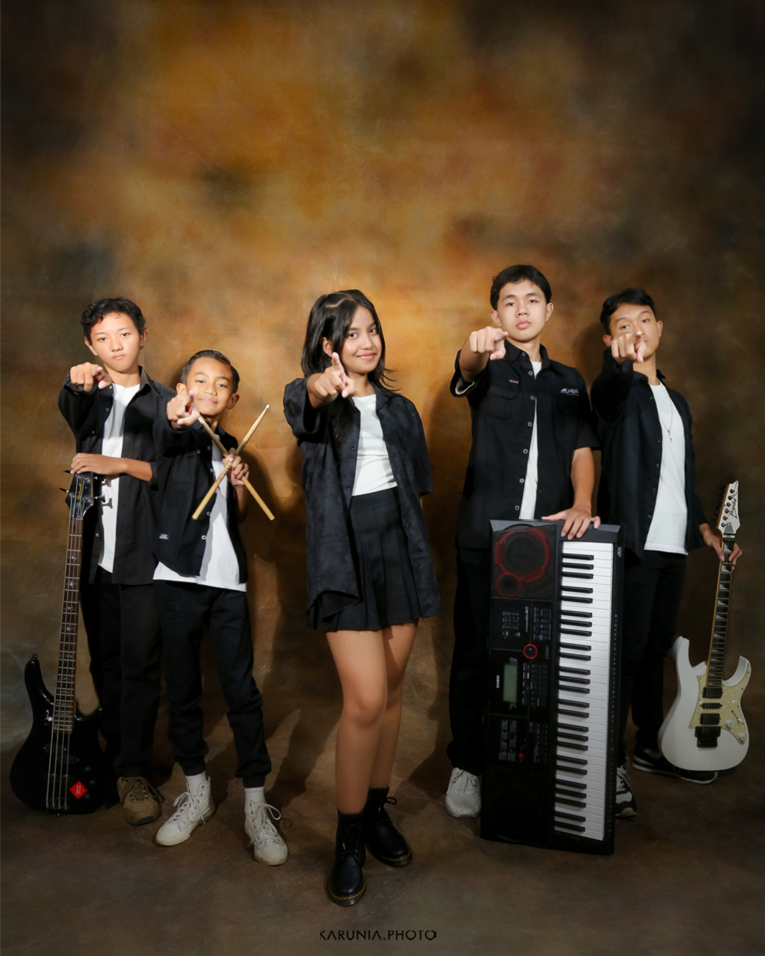 Sports team in uniform posing with championship trophy on field after winning game