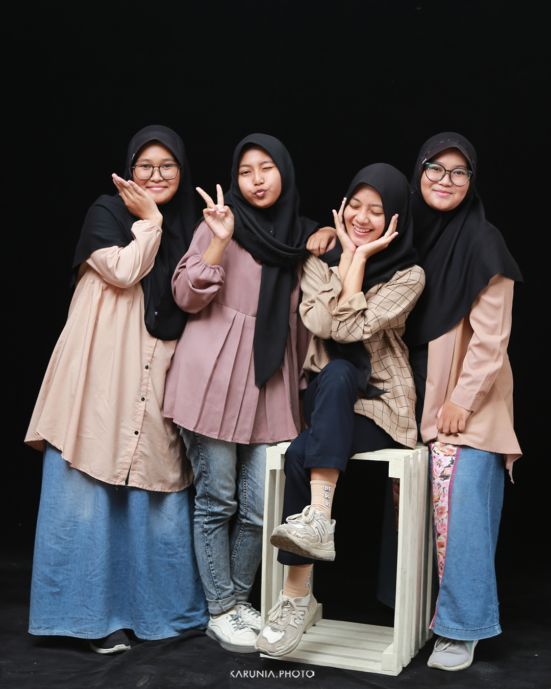 Sports team in uniform posing with championship trophy on field after winning game