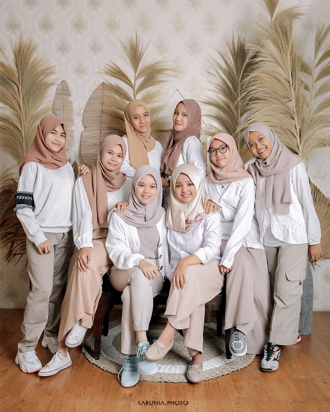 Music band members posing with instruments in urban alleyway with dramatic lighting