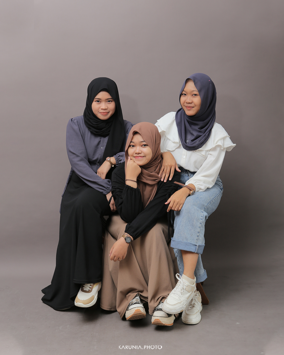 Sports team in uniform posing with championship trophy on field after winning game