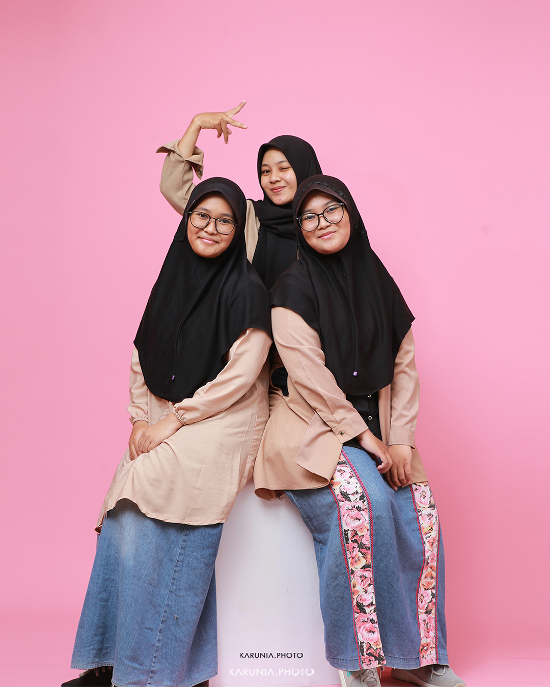 Sports team in uniform posing with championship trophy on field after winning game